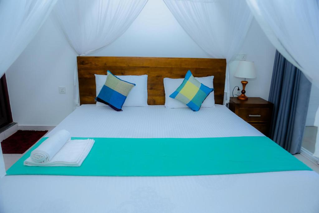 Postel nebo postele na pokoji v ubytování Shanora Beach