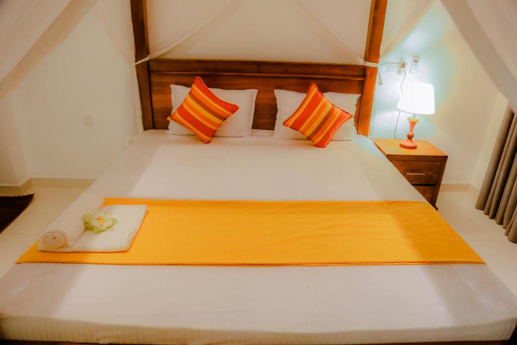 Postel nebo postele na pokoji v ubytování Shanora Beach