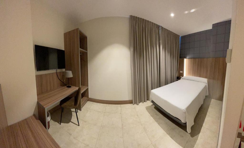 Postel nebo postele na pokoji v ubytování Hotel Camino Real
