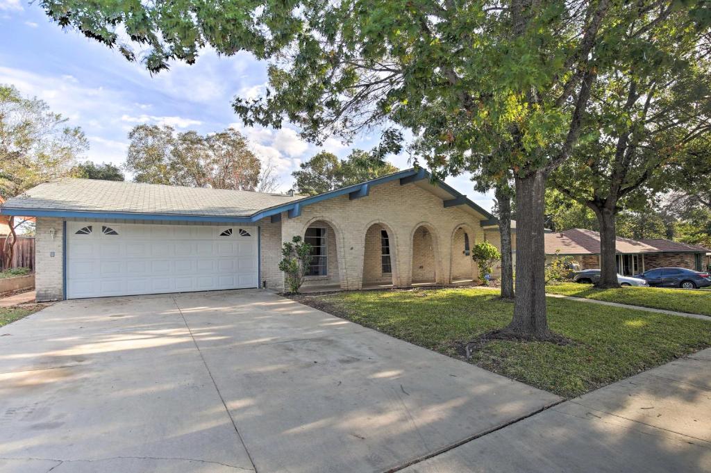 a house with a driveway and a garage at San Antonio Home Near Nature, Parks and Trails in San Antonio