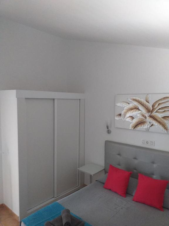 A bed or beds in a room at Santa Barbara by Placida Mar