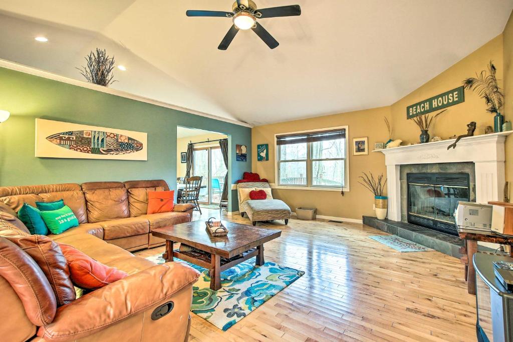 a living room with a couch and a fireplace at Lake Michigan Gem Less Than Half Miles to Private Beach! in Mears