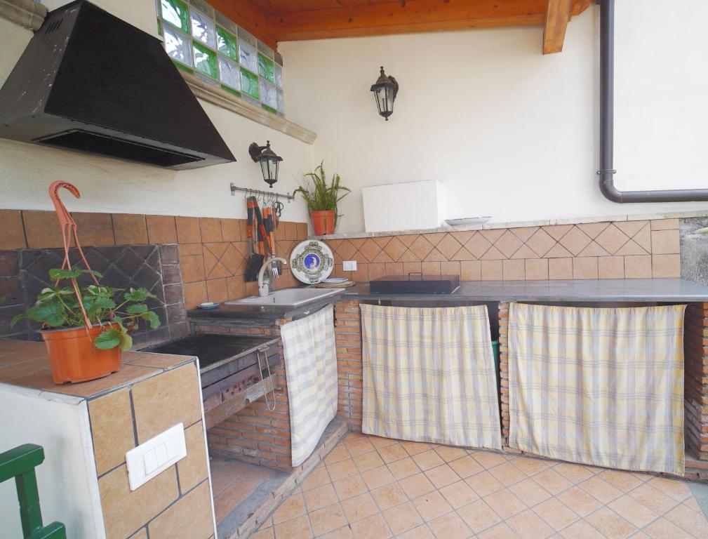 Kuchnia lub aneks kuchenny w obiekcie Etna Rooftop Apartment