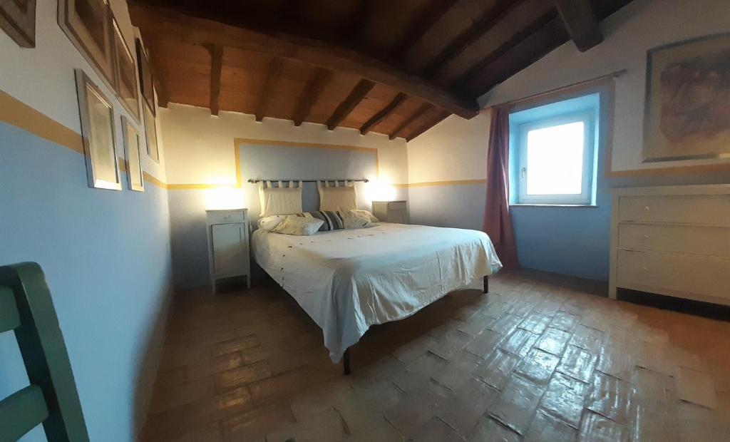 Posteľ alebo postele v izbe v ubytovaní Casa del Piano