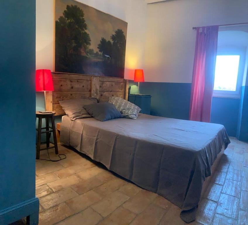Posteľ alebo postele v izbe v ubytovaní Casa del Piano