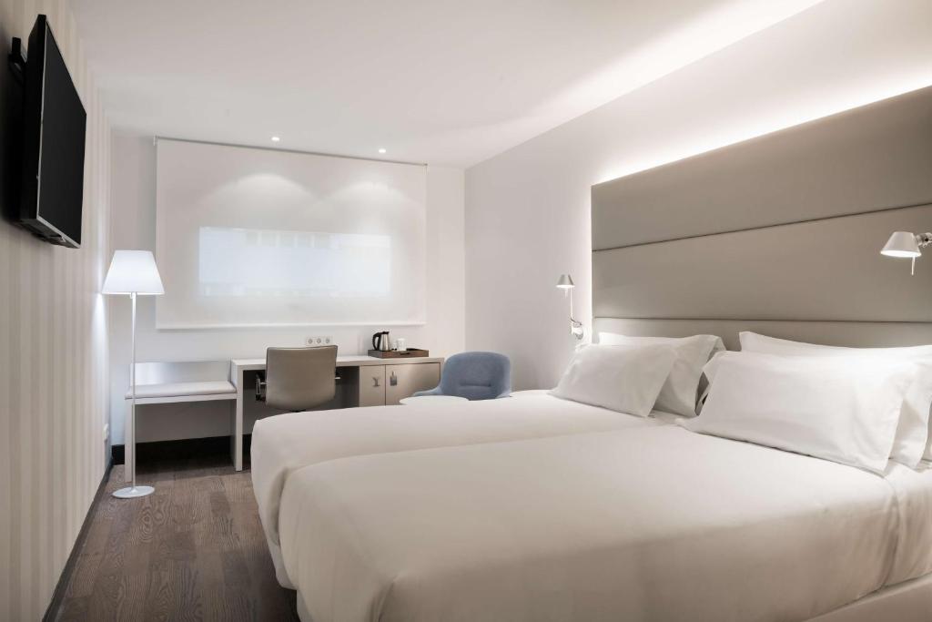 Кровать или кровати в номере NH Ciudad Real