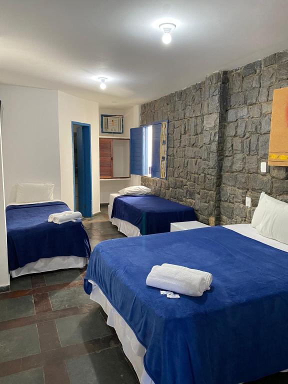 Postel nebo postele na pokoji v ubytování Pousada Villa Grécia