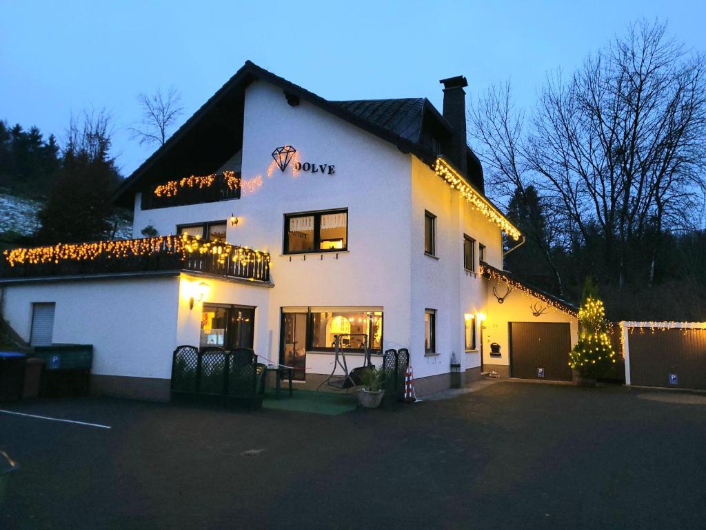 a large white building with christmas lights on it at Familiehuis Dolve in Mürlenbach