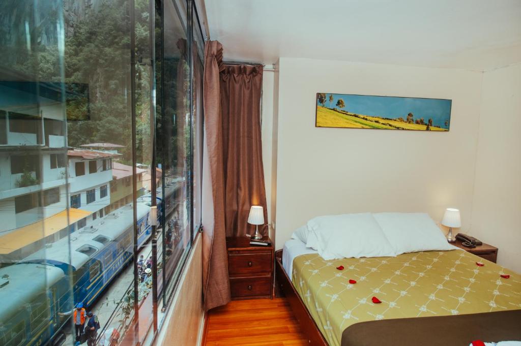 Rúm í herbergi á Nativus Hostel Machu Picchu
