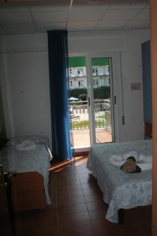 Postel nebo postele na pokoji v ubytování Hotel Trifoglio
