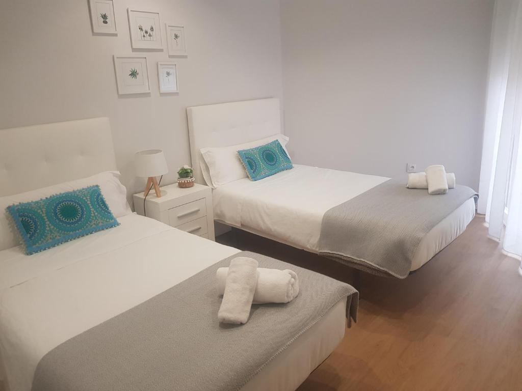 Posteľ alebo postele v izbe v ubytovaní QUATRE CASAS