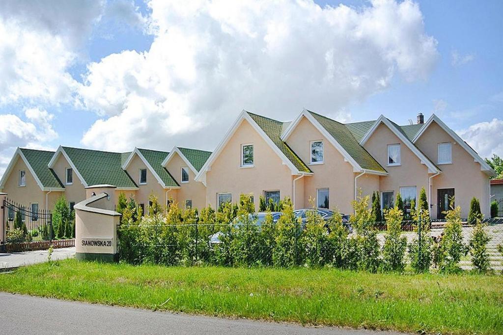 a row of houses with green roofs at Holiday resort, Osieki in Osieki