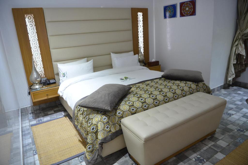 Postel nebo postele na pokoji v ubytování Aralia Boutique Hôtel