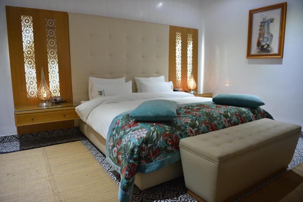 Postel nebo postele na pokoji v ubytování Aralia Boutique Hôtel