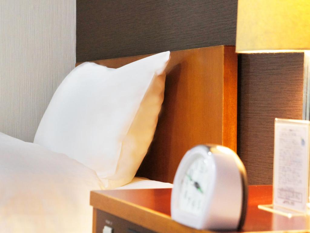 Postel nebo postele na pokoji v ubytování Hotel Abest Nagano Ekimae
