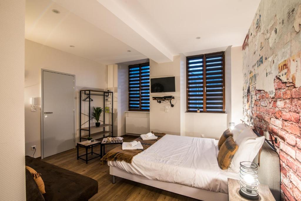 Postel nebo postele na pokoji v ubytování NOUVEAU - L'Atelier - Centre Ville