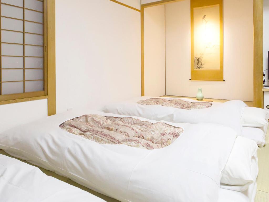 Postel nebo postele na pokoji v ubytování H.B.P HOTEL