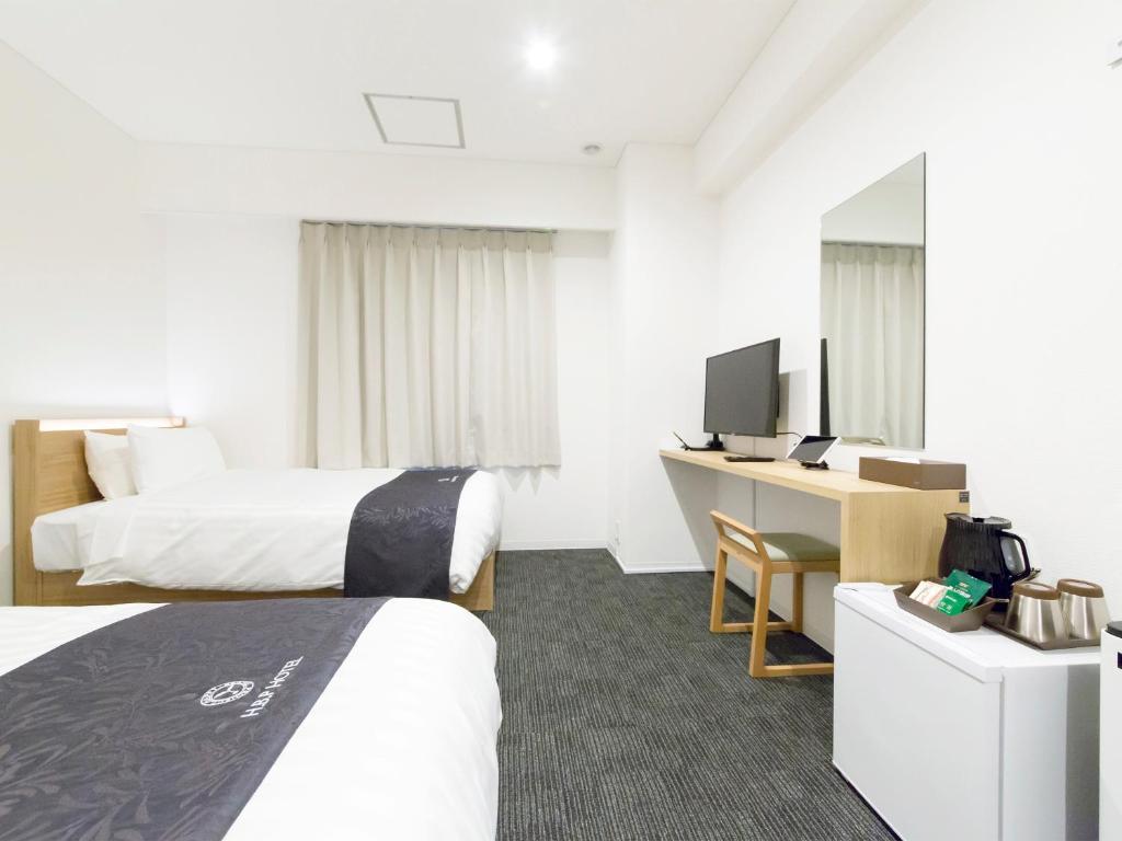 Postel nebo postele na pokoji v ubytování H.B.P HOTEL