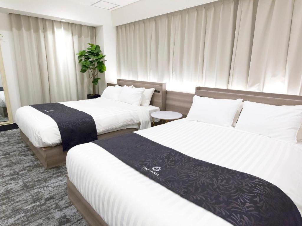 Postel nebo postele na pokoji v ubytování H.B.P HOTEL