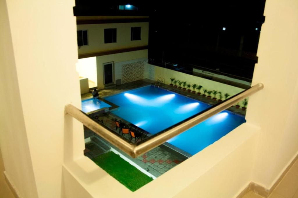 a view of a swimming pool at night at Sea Facing Beach Resort in Mandarmoni