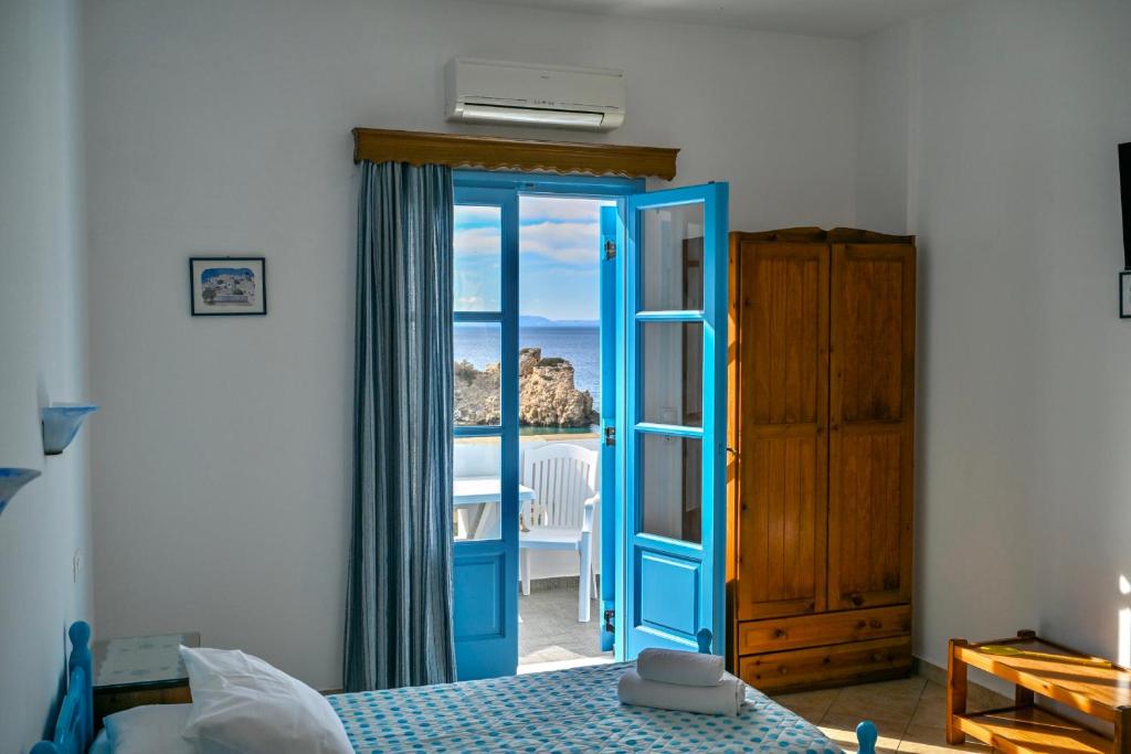 Postel nebo postele na pokoji v ubytování Blue Bliss