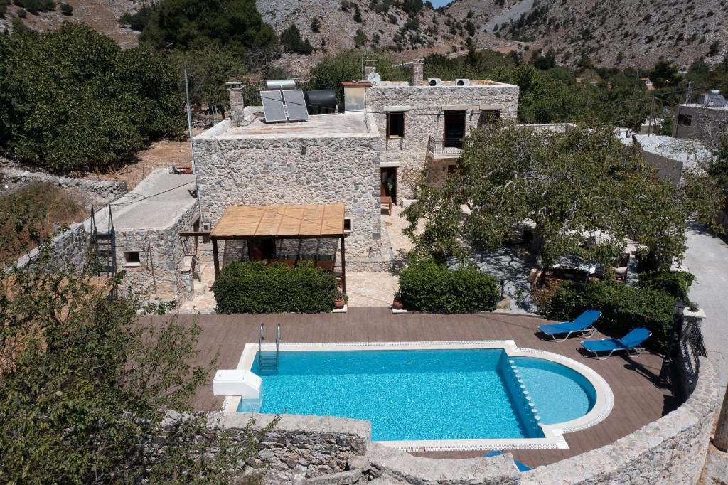 an aerial view of a house with a swimming pool at Archodiko Villa Imbros in Ímbros