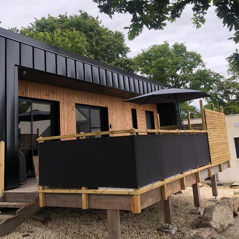 a house being built on top of a wooden platform at Maison chaleureuse et cosy en bois de 2021 Près de Quimper in Ergué-Gabéric