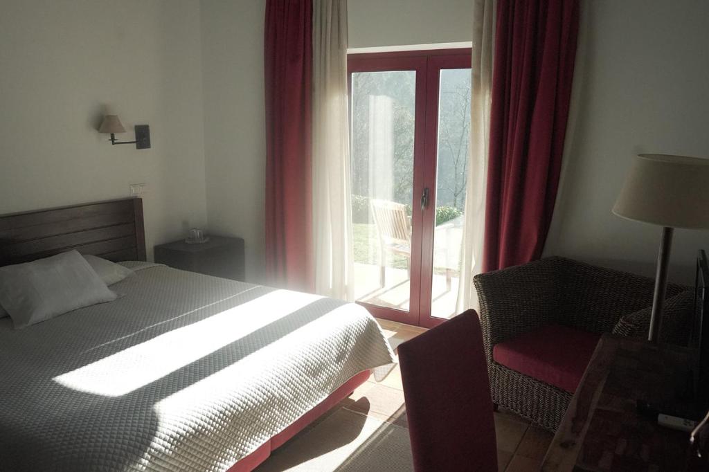 Uma cama ou camas num quarto em Hotel Rural Quinta de Novais