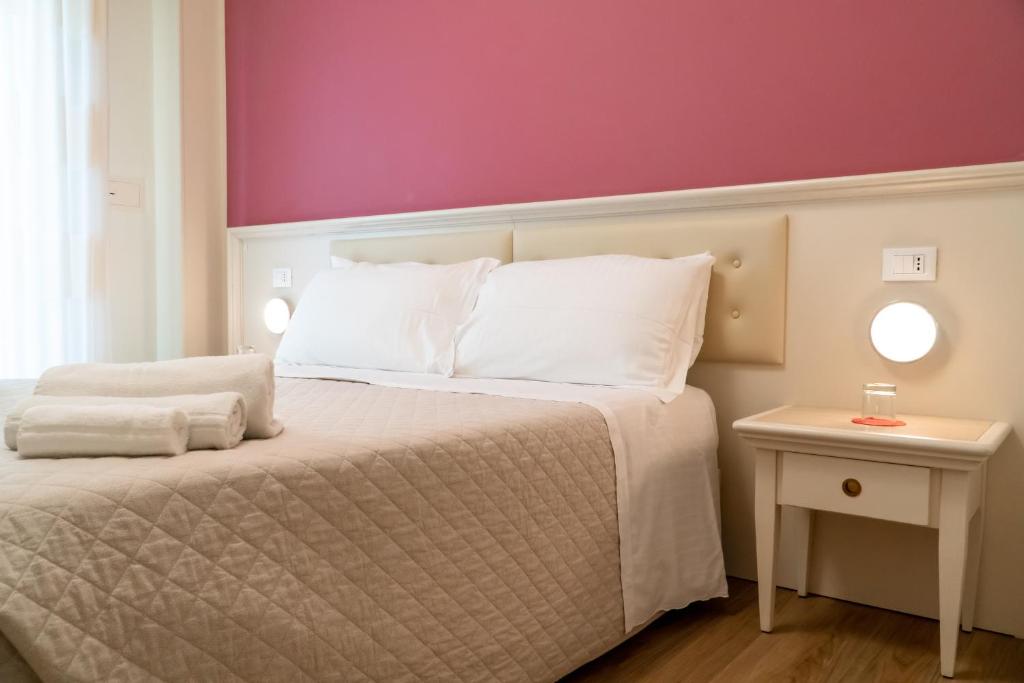 Postel nebo postele na pokoji v ubytování Hotel Orchidea