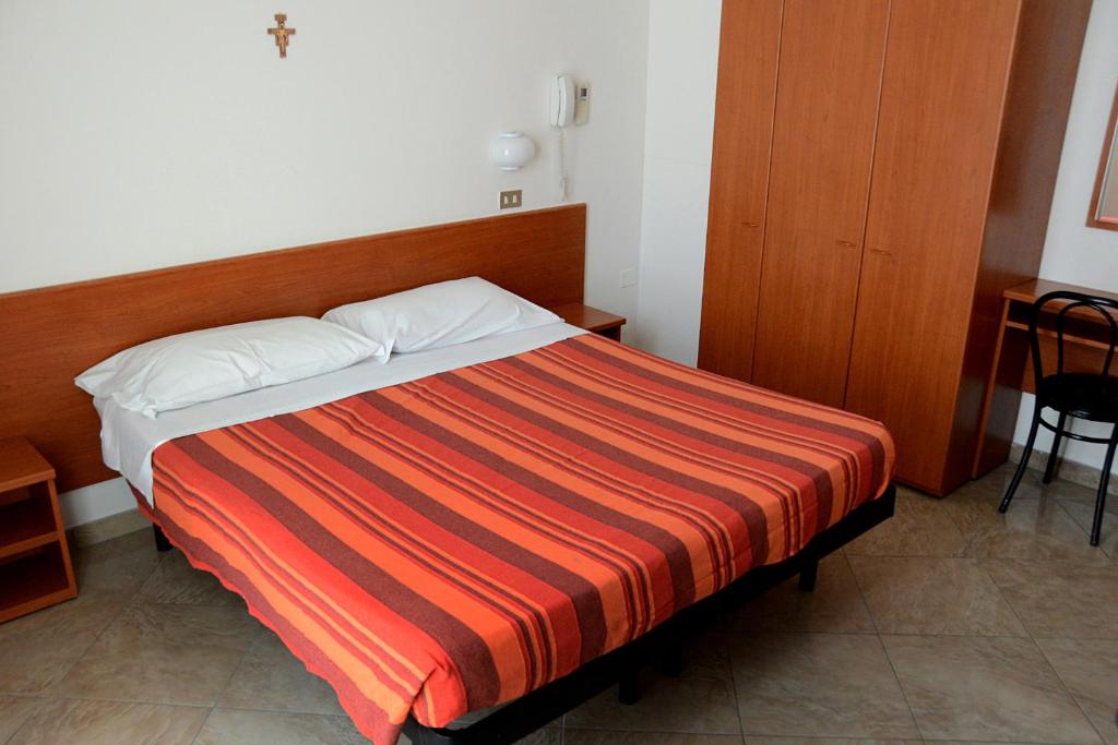 Postel nebo postele na pokoji v ubytování Hotel Trinidad