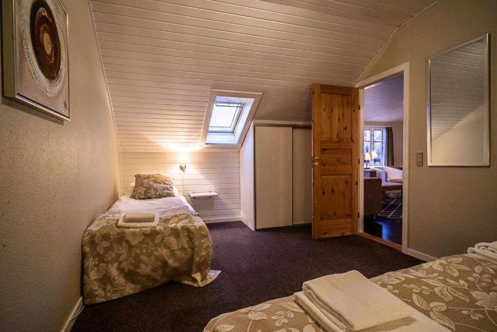 Postel nebo postele na pokoji v ubytování Hotel Allinge