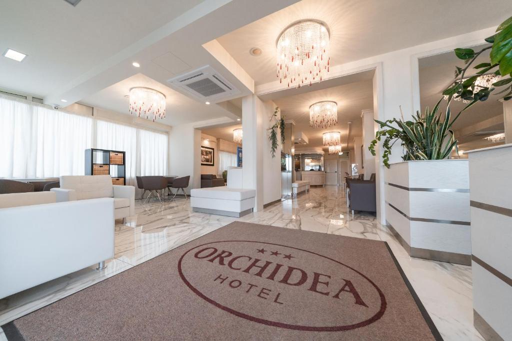 TV a/nebo společenská místnost v ubytování Hotel Orchidea