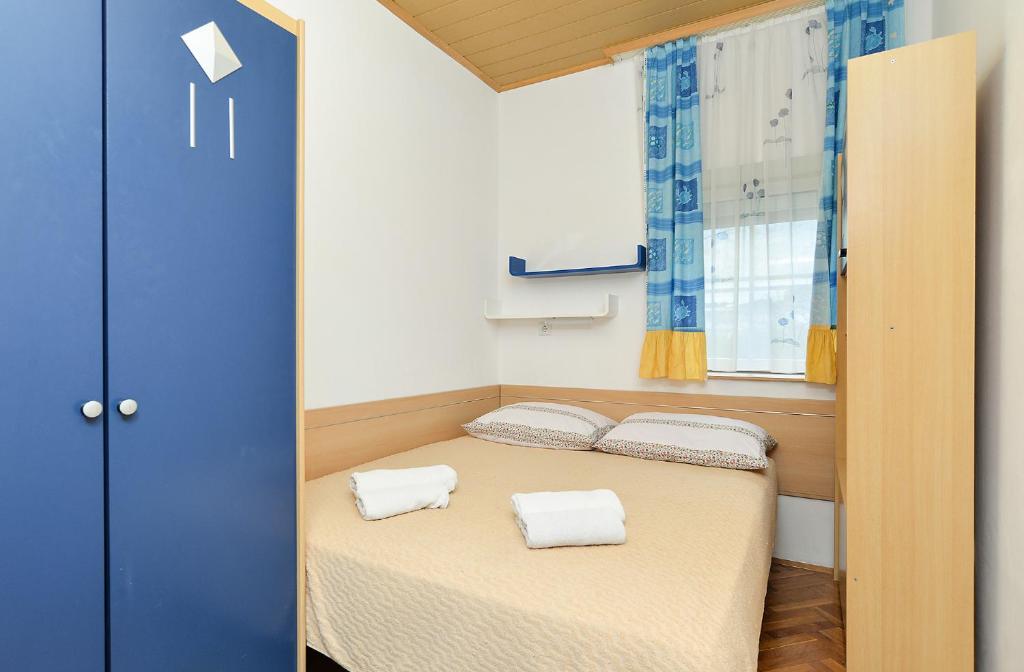 Łóżko lub łóżka w pokoju w obiekcie Apartments Jasna 1128