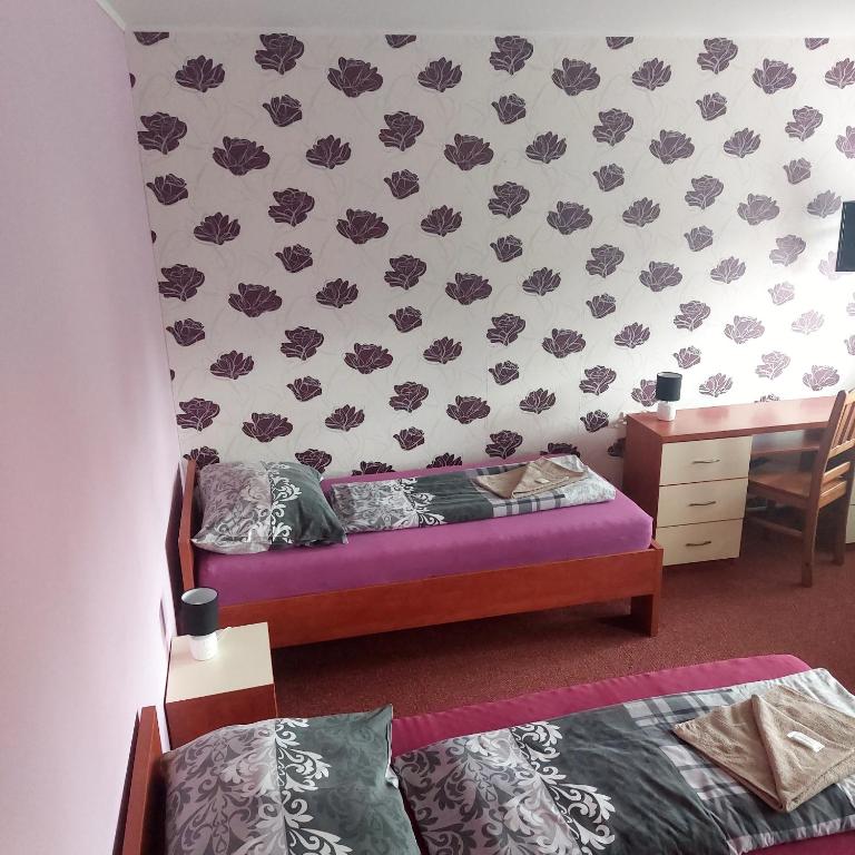 Postel nebo postele na pokoji v ubytování Penzion Na Kopečku