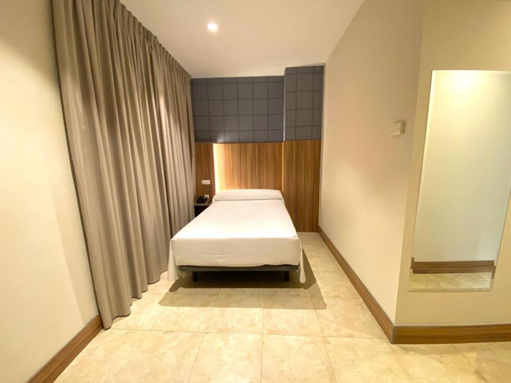 Postel nebo postele na pokoji v ubytování Hotel Camino Real