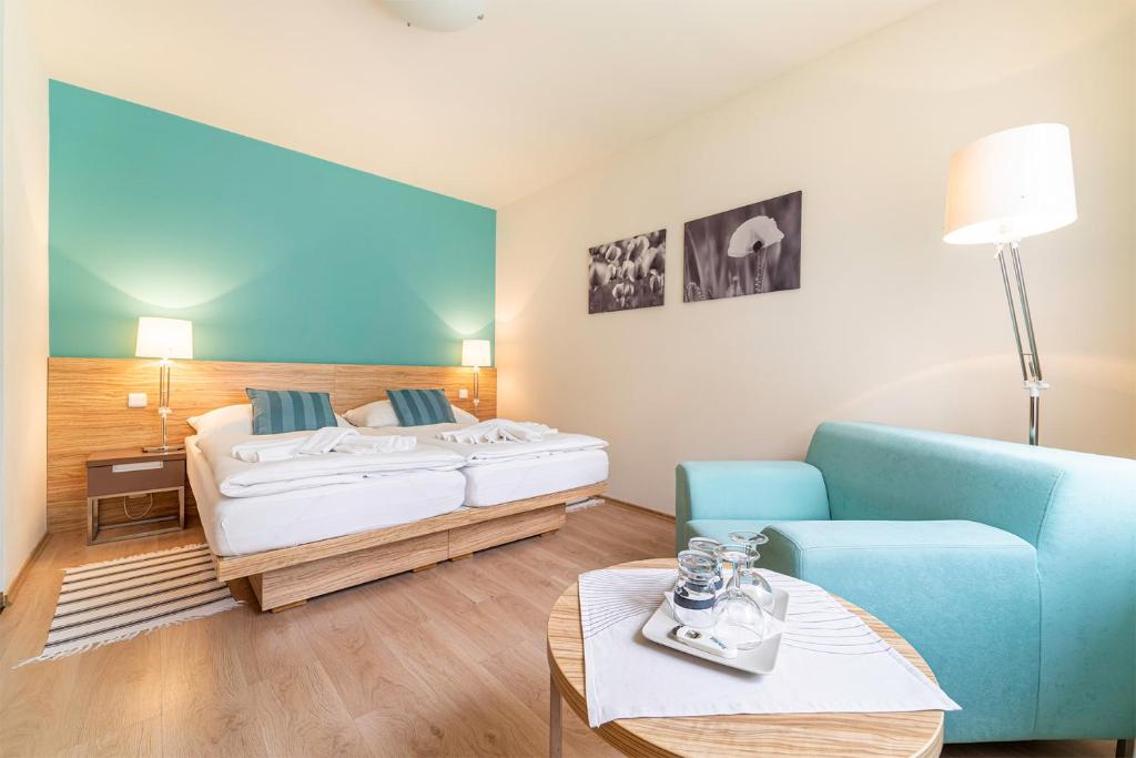 Posteľ alebo postele v izbe v ubytovaní Hotel Vyhlídka