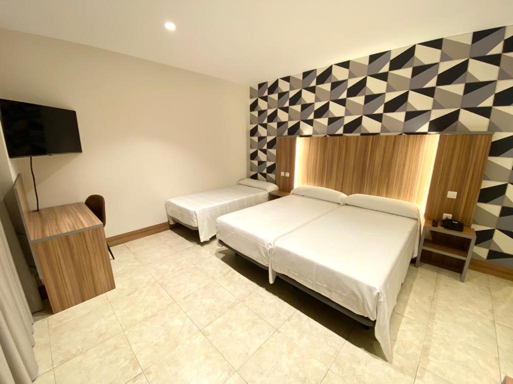 Postel nebo postele na pokoji v ubytování Hotel Camino Real