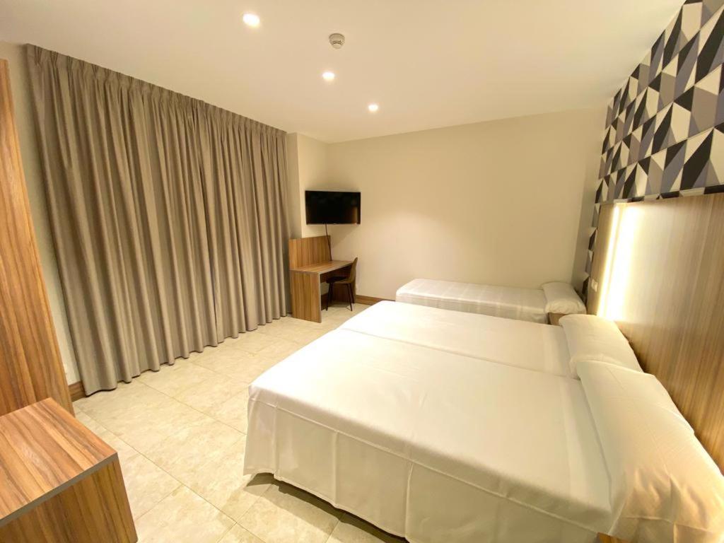 Postel nebo postele na pokoji v ubytování Hotel Camino Real