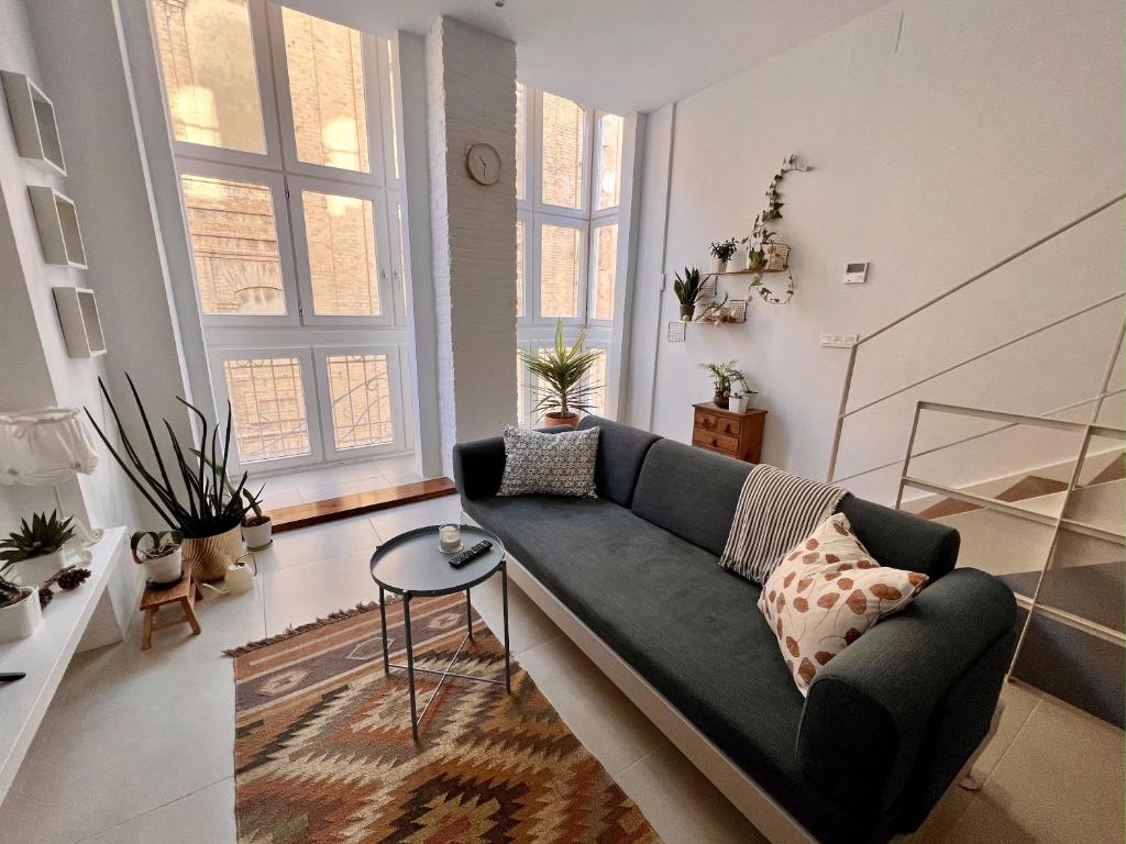 a living room with a couch and a table at Beautiful house in Cartagena's historic center in Cartagena