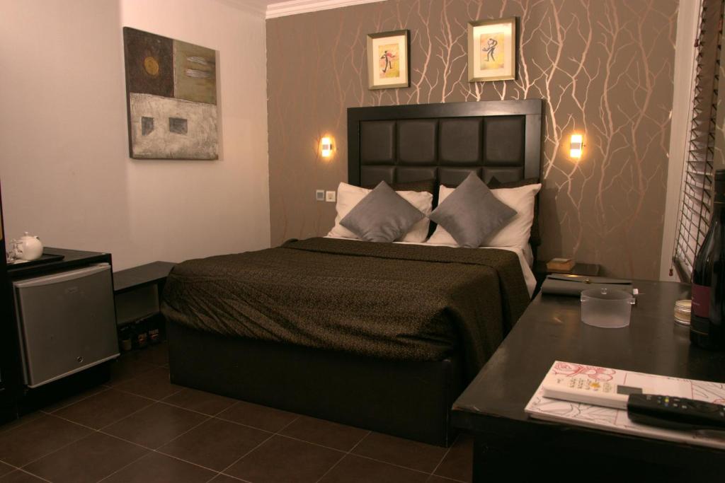 Postel nebo postele na pokoji v ubytování Angel Hotel