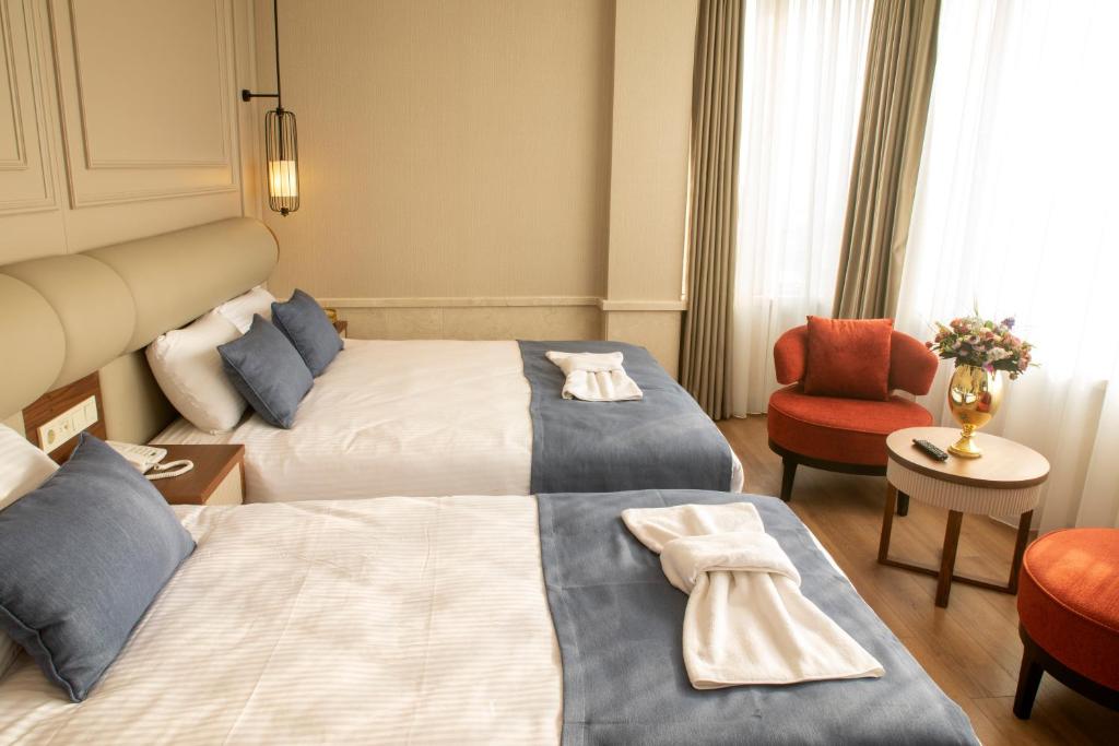 Postel nebo postele na pokoji v ubytování Martinenz Hotel