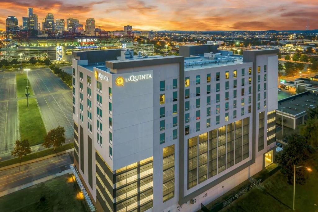 an aerial view of a building with a city in the background at La Quinta Inn & Suites by Wyndham Nashville Downtown Stadium in Nashville