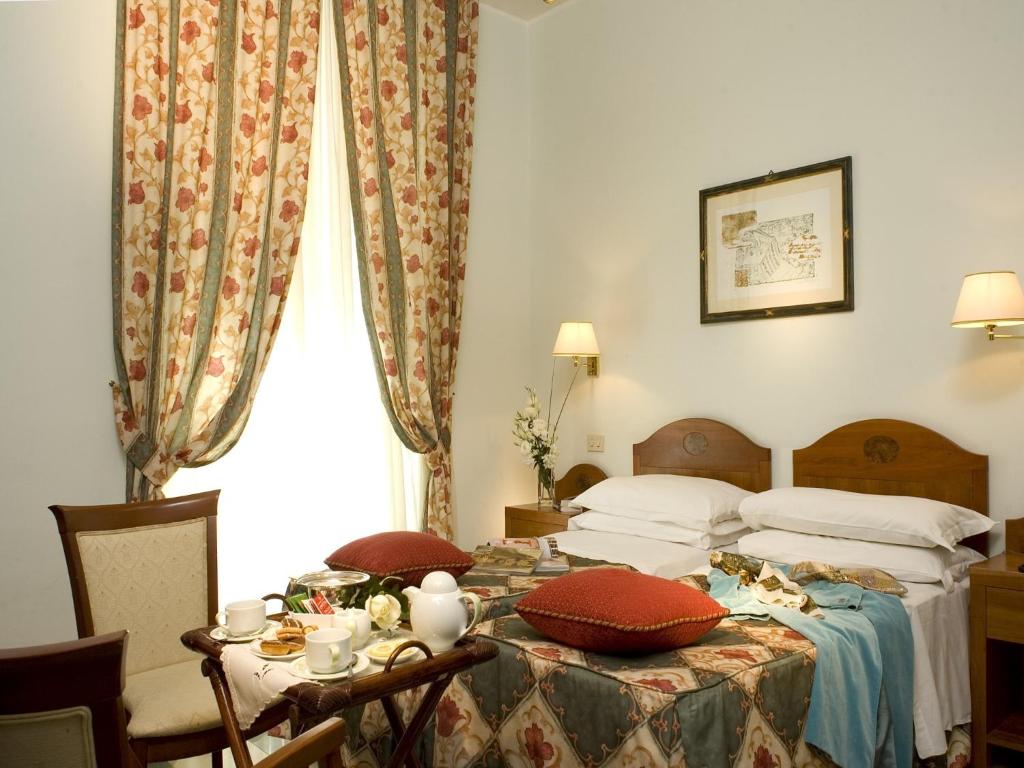 Postel nebo postele na pokoji v ubytování Hotel Aberdeen