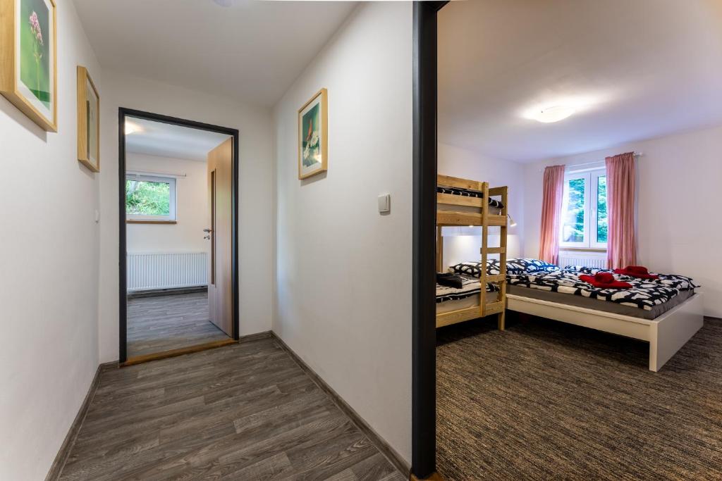 Postel nebo postele na pokoji v ubytování Apartmán Liška v Peci - apartmánový dům Horalka, Pec pod Sněžkou