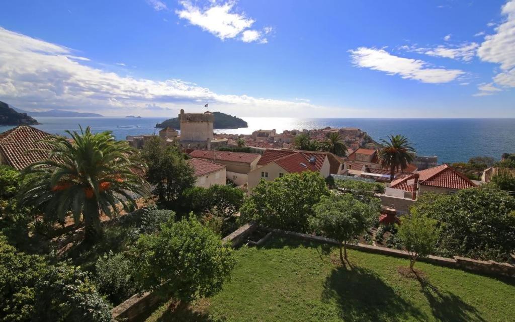 a view of a town with the ocean in the background at Vicina Summer Apartments in Dubrovnik