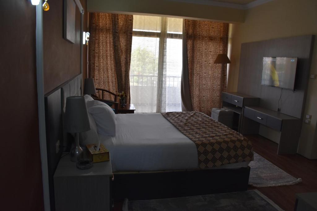 Postel nebo postele na pokoji v ubytování Jewel Luxor Hotel