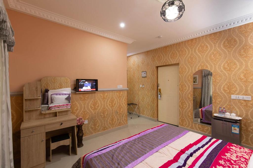 TV a/nebo společenská místnost v ubytování AG HOTEL AND SUITES