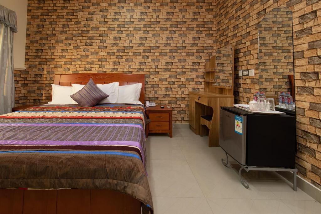 Postel nebo postele na pokoji v ubytování AG HOTEL AND SUITES