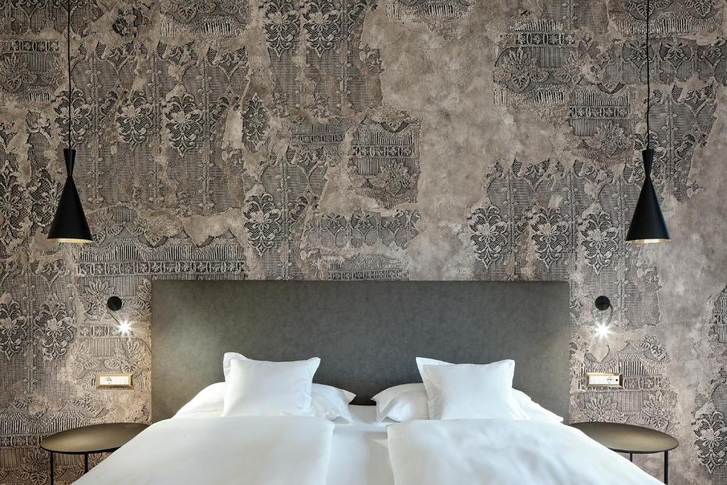 Postel nebo postele na pokoji v ubytování Windsor Merano Hotel & Suites