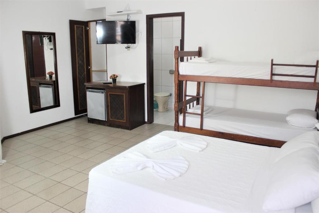 Cama ou camas em um quarto em Hotel Bela Onda